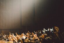 people raising their hands